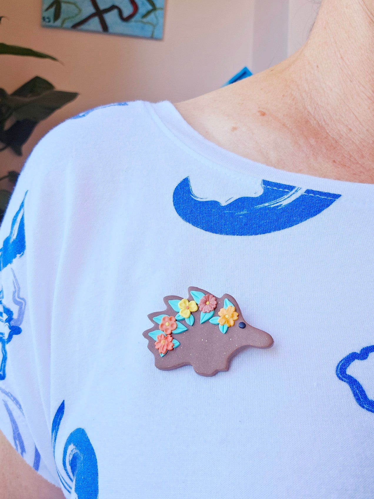 Echidna brooch with flowers