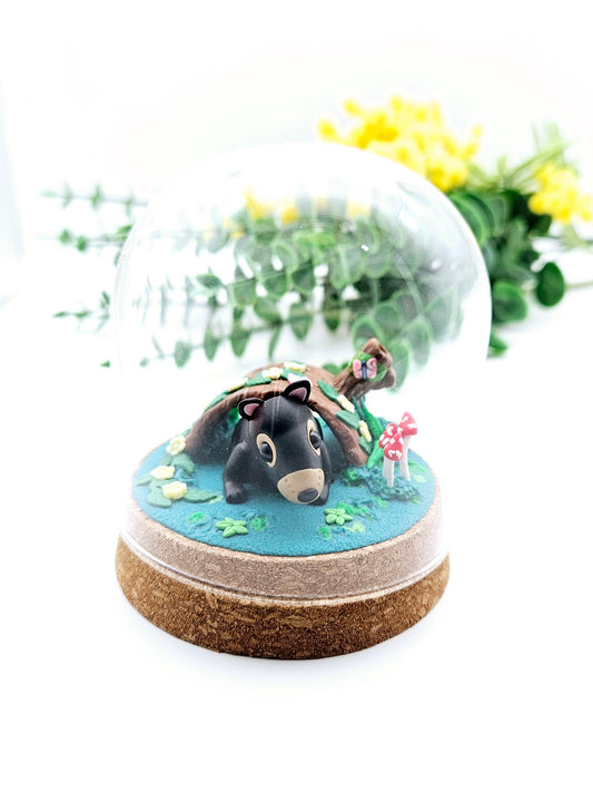 Tasmanian devil in burrow under glass