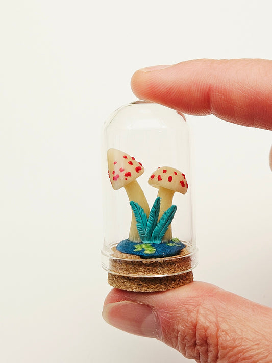 Glow in the dark mushrooms with glass cloche