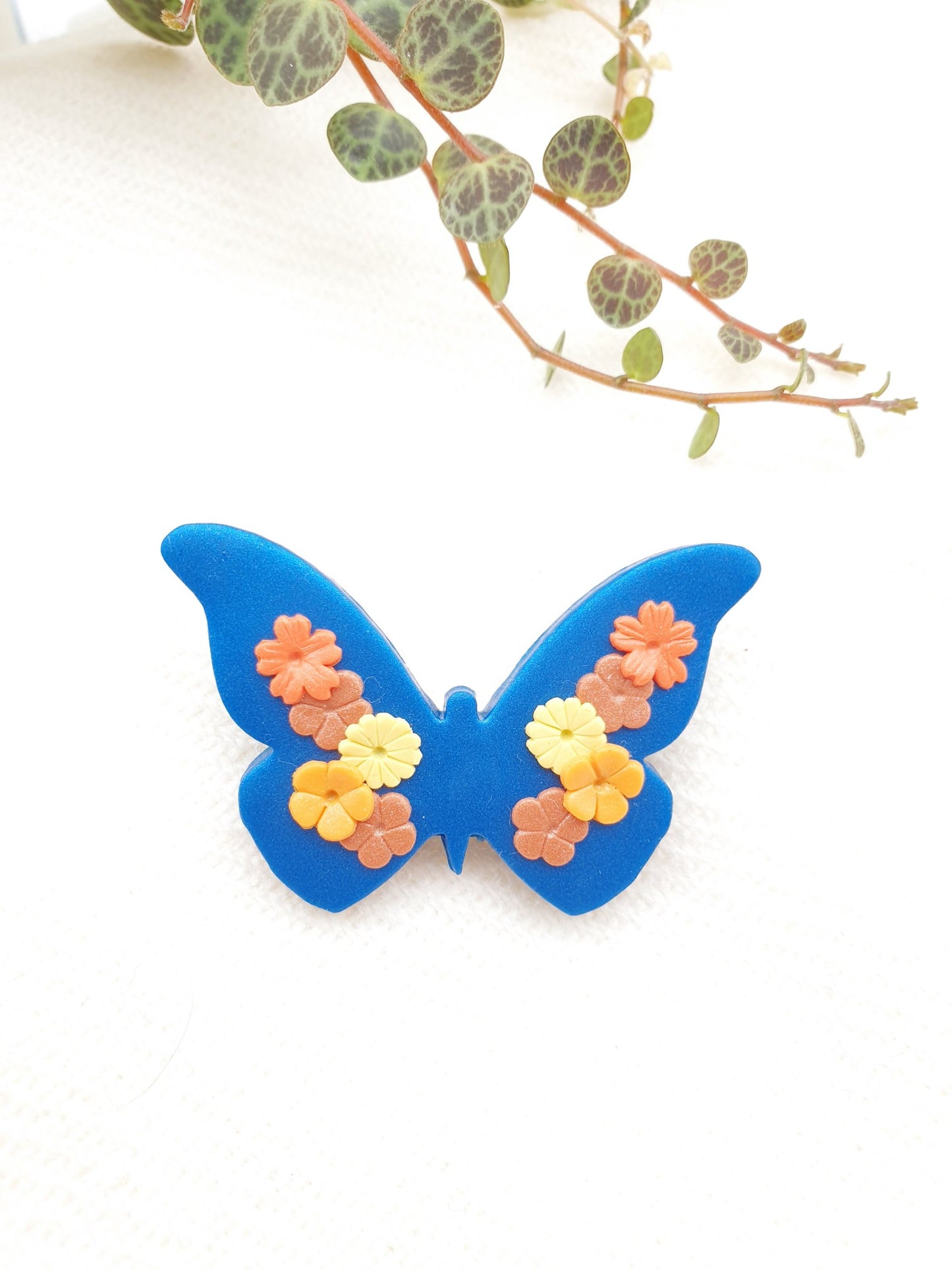 Butterfly brooch with flowers