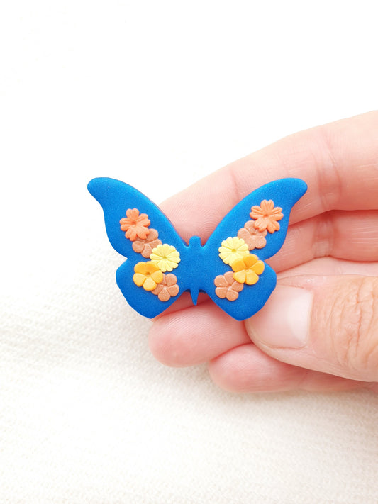 Butterfly brooch with flowers