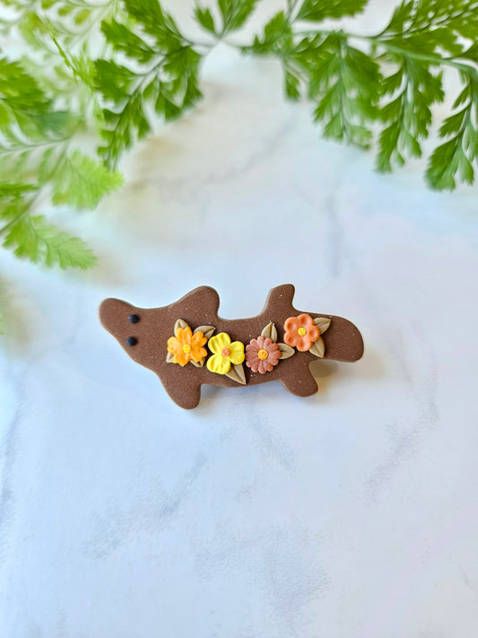 Platypus brooch with flowers