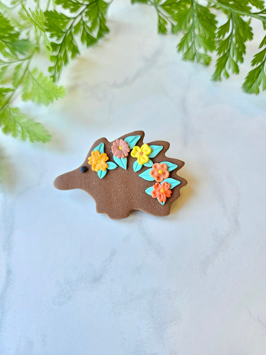 Echidna brooch with flowers