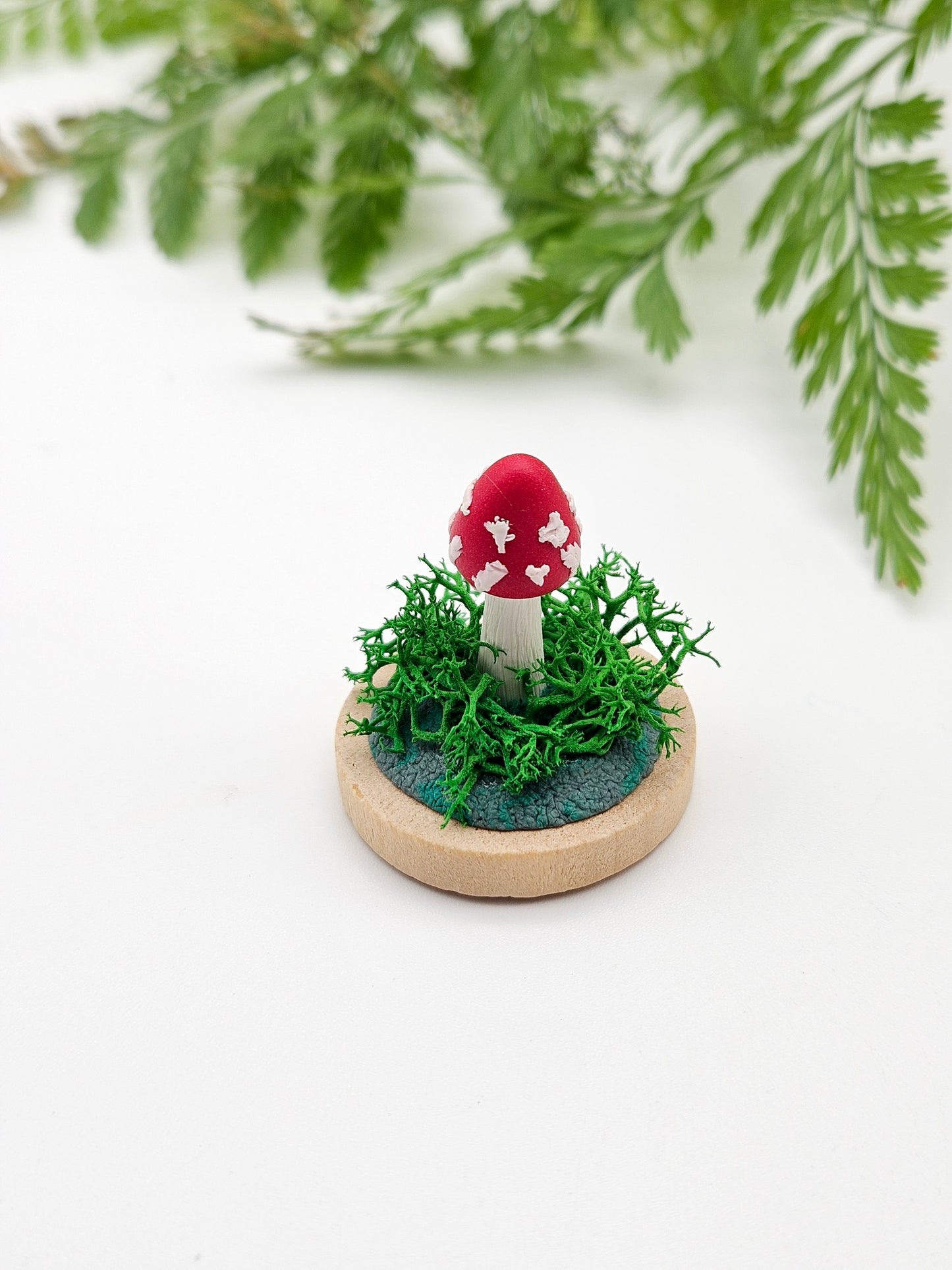 Mini amanita mushroom with real moss sculpture