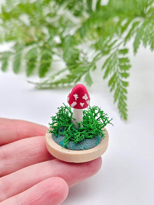 Mini amanita mushroom with real moss sculpture