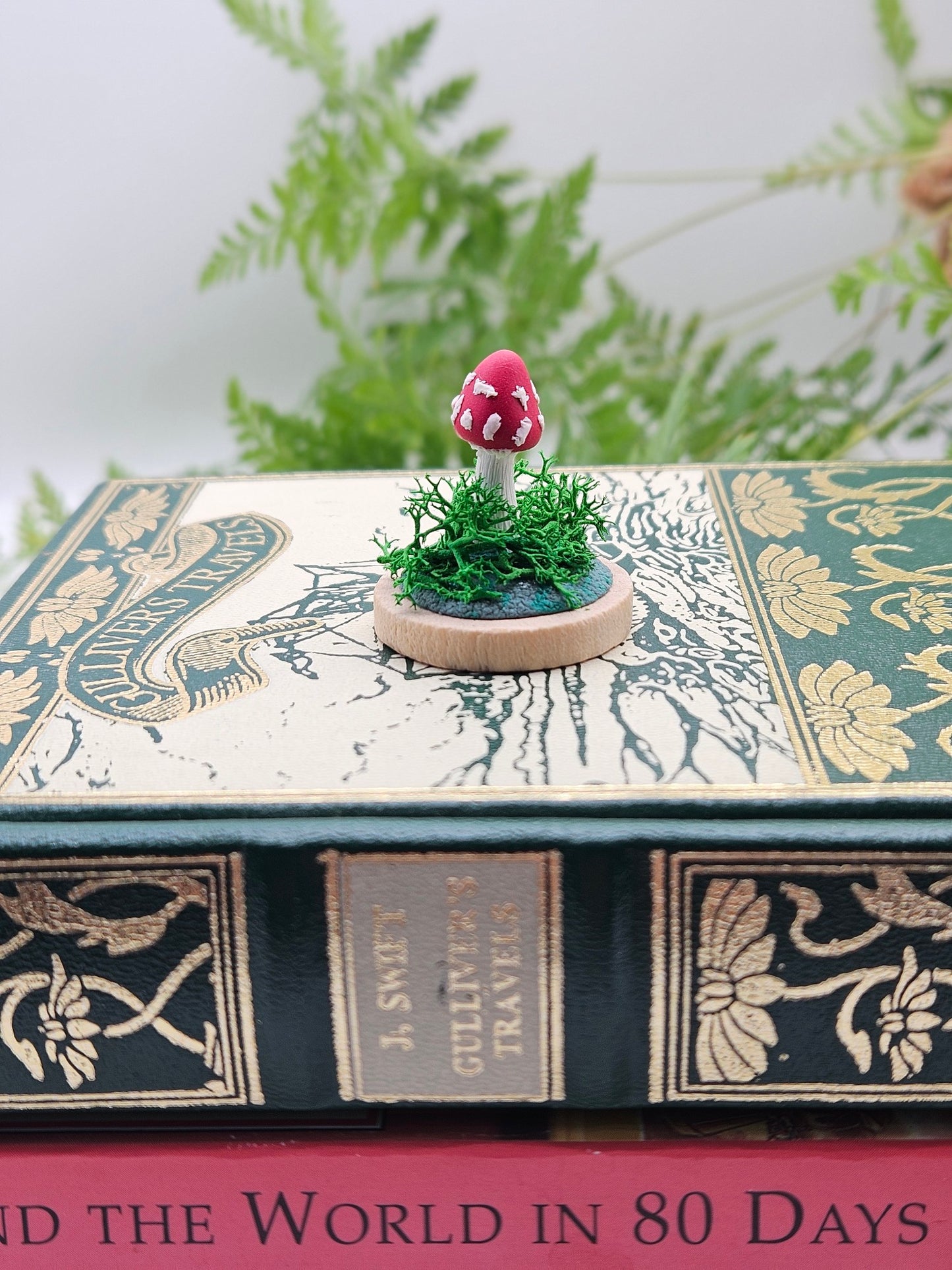 Mini amanita mushroom with real moss sculpture