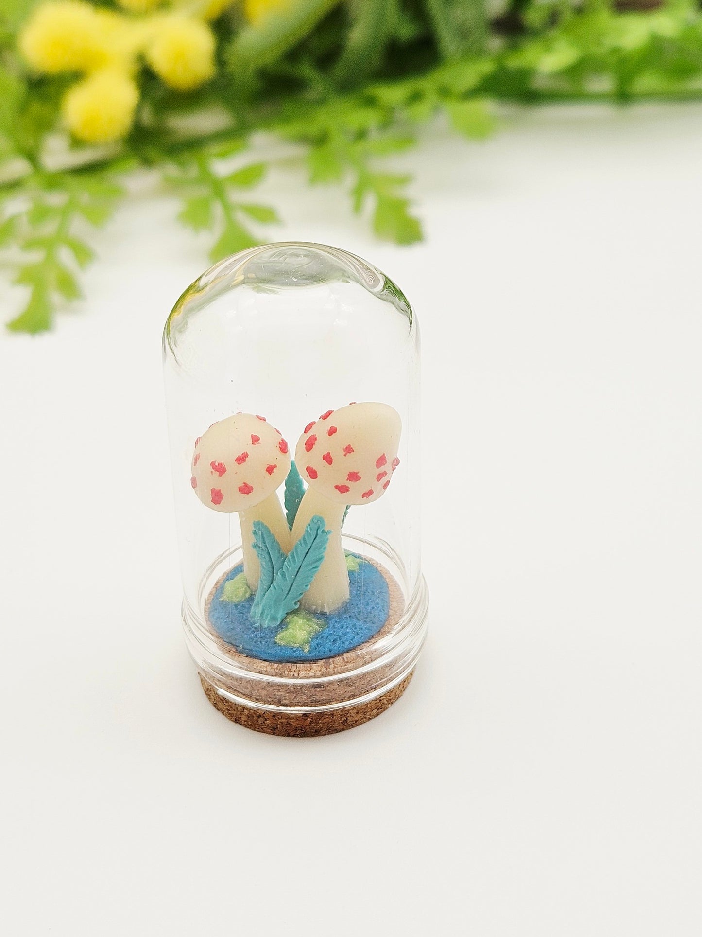 Glow in the dark mushrooms with glass cloche