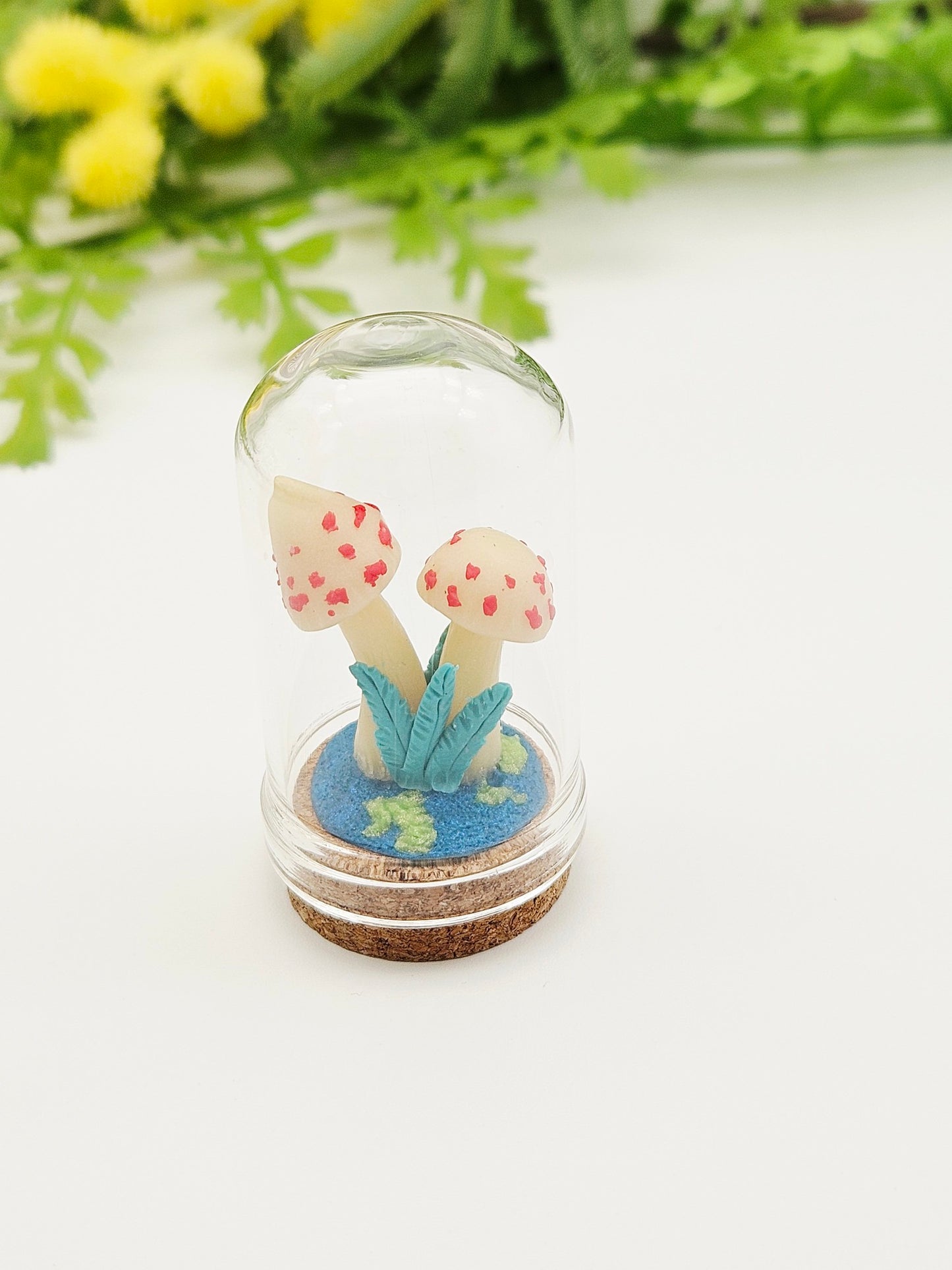 Glow in the dark mushrooms with glass cloche