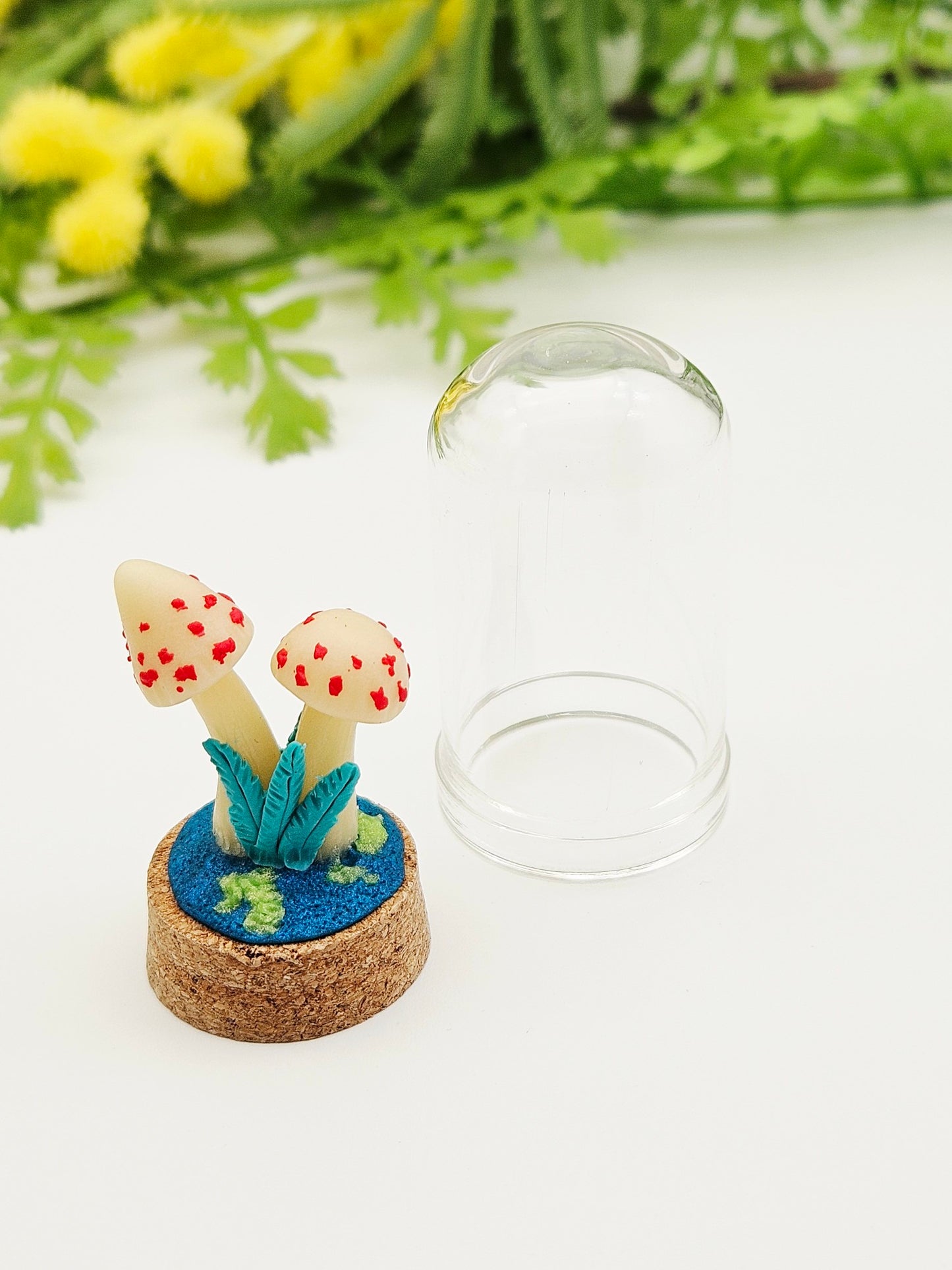 Glow in the dark mushrooms with glass cloche