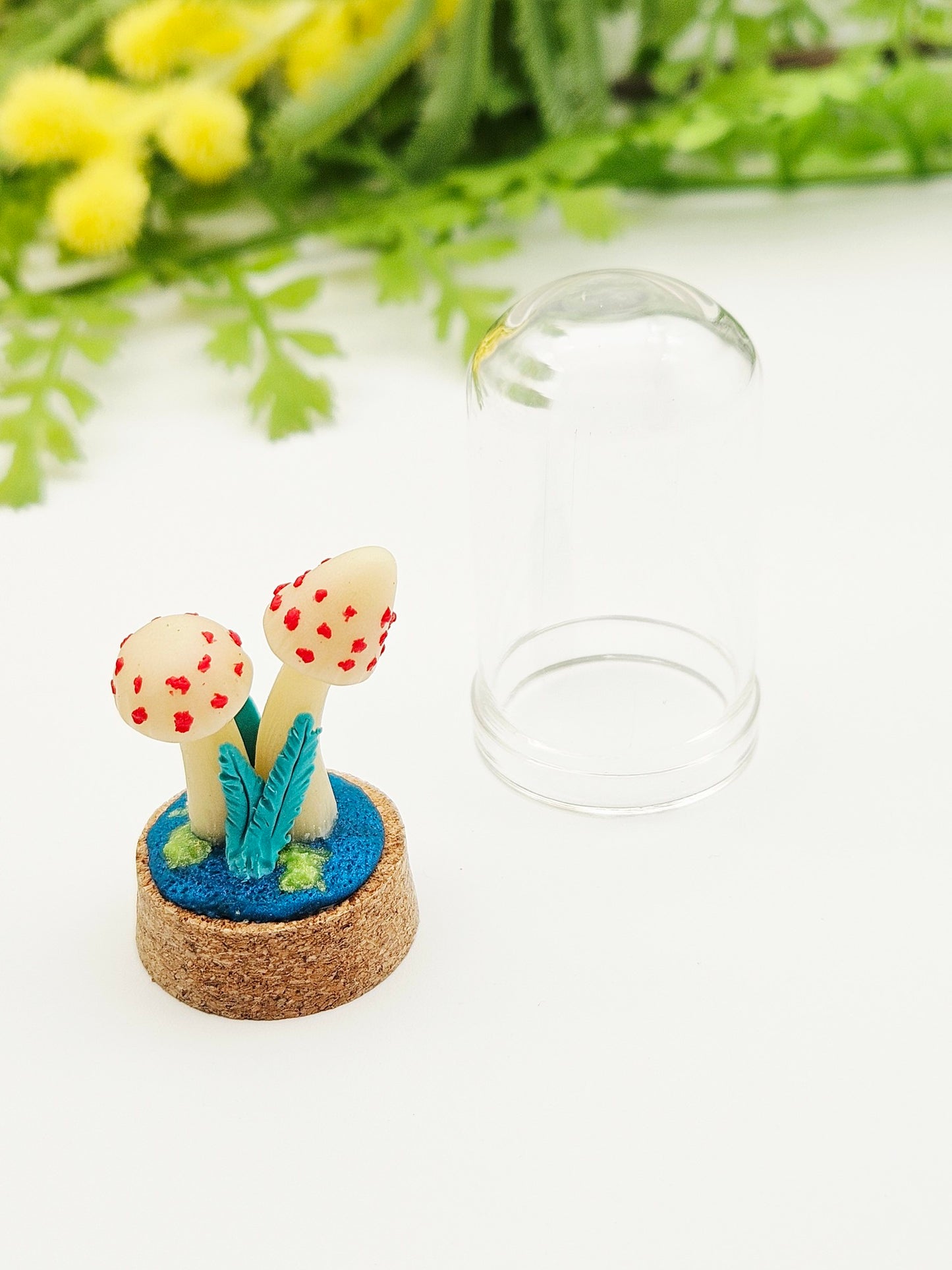 Glow in the dark mushrooms with glass cloche