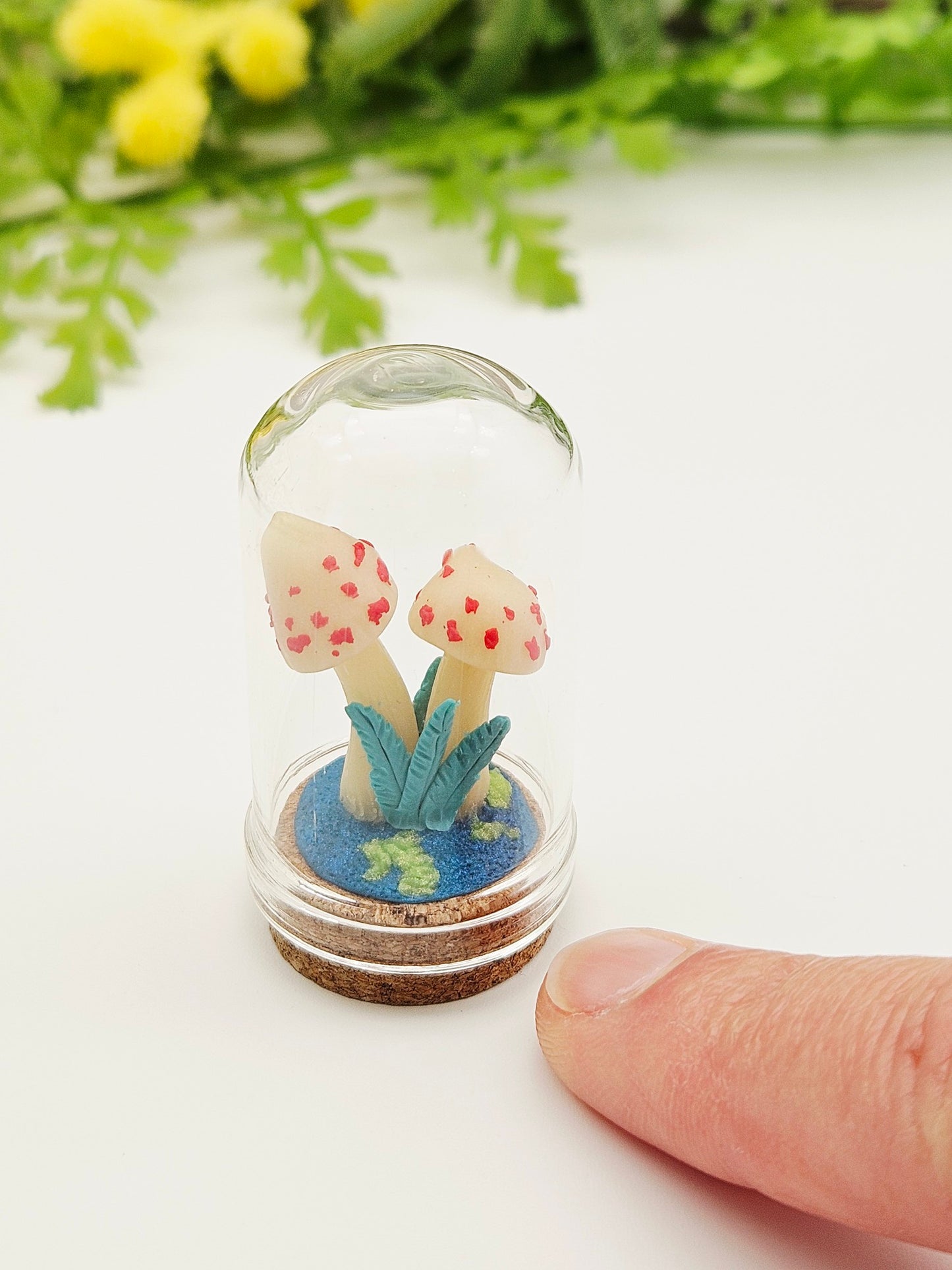 Glow in the dark mushrooms with glass cloche