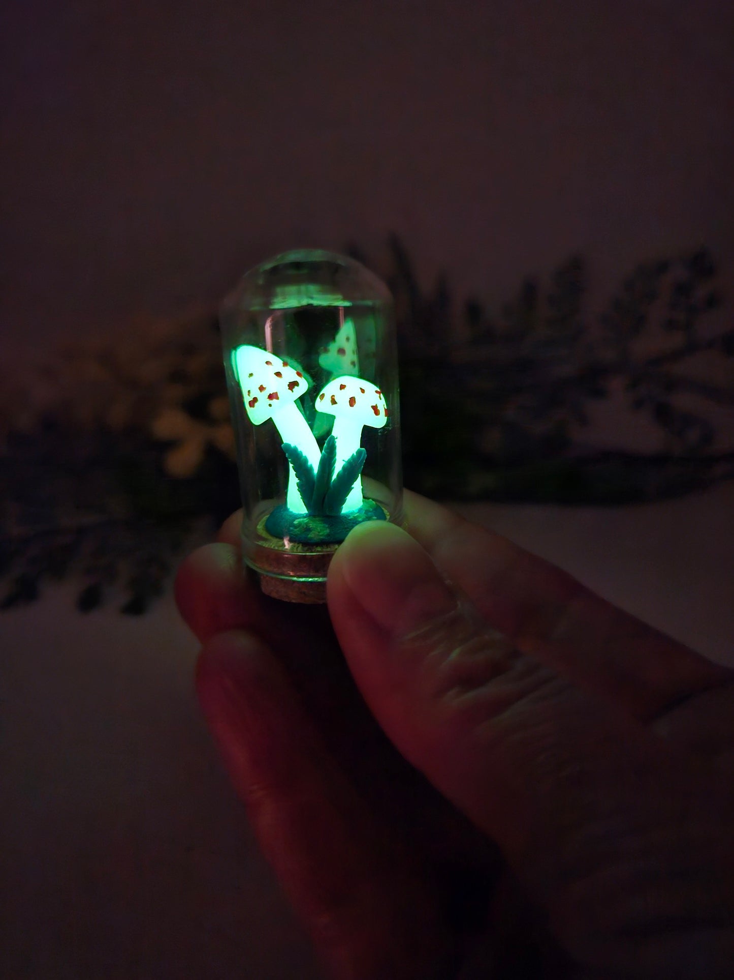 Glow in the dark mushrooms with glass cloche