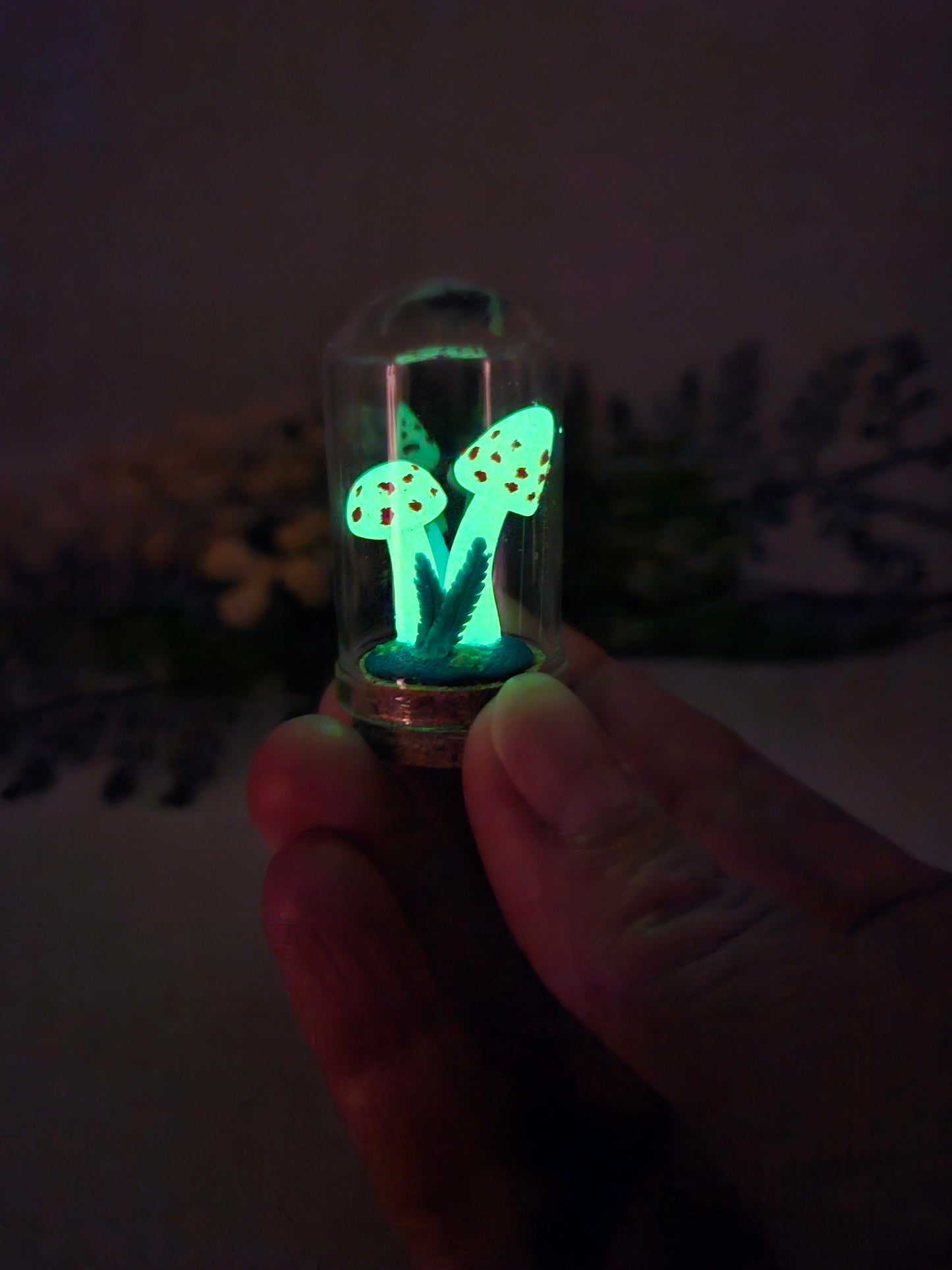 Glow in the dark mushrooms with glass cloche