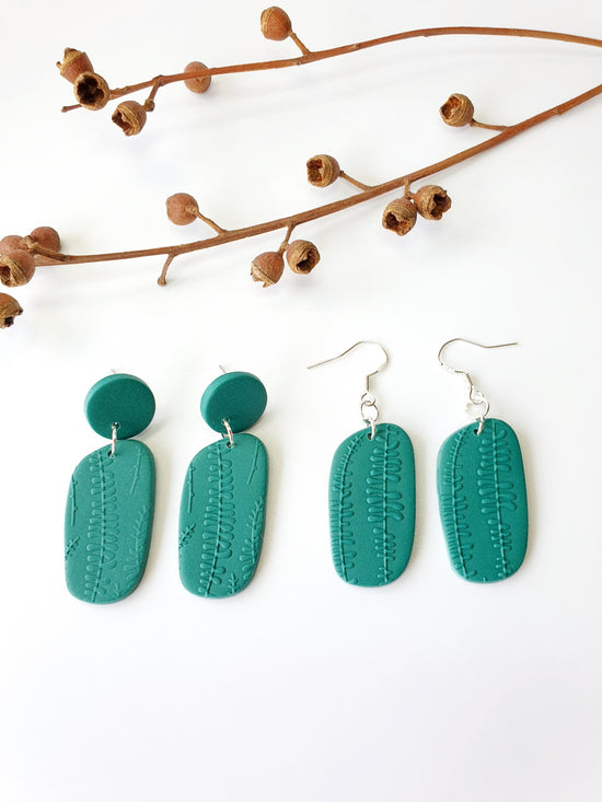 Hand made beautiful botanical polymer clay earrings. Forest green with a raised fern leaf imprint